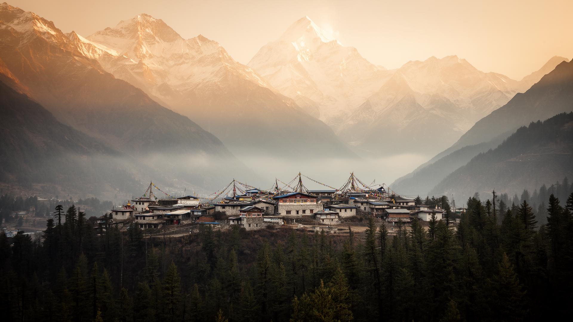 A Himalayan village at dawn with prayer flags and snow peaks behind